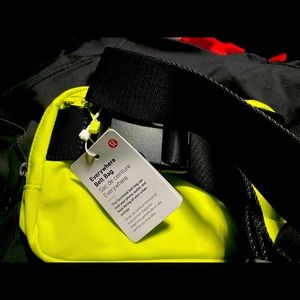 Lululemon rare color belt bag. Neon yellow with black strap and embellishments